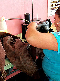 repairing a leather garment at LA Leather Cleaners